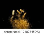 Small photo of Gold Ingot Chinese Money bar token fly with dust particle in air. Chinese new year Yuanbao gold bar floating to golden money sand particle. Language is wealthy prosperity. Black background isolated