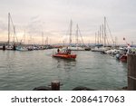 Small photo of Acre, Israel, December 04, 2021 : Tourist motor boat with tourists enters the harbor after boat trip in Acre old city, in northern Israel