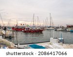 Small photo of Acre, Israel, December 04, 2021 : Tourist motor boat with tourists enters the harbor after boat trip in Acre old city, in northern Israel