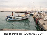 Small photo of Acre, Israel, December 04, 2021 : A small fishing boat tied to a port pier on the Mediterranean in Acre old city, in northern Israel