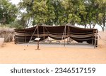 Small photo of Abu Dhabi, United Arab Emirates, March 19, 2023 : Antique Bedouin sun shade in the yard of the Heritable village Abu Dhabi museum in Abu Dhabi city, United Arab Emirates