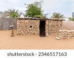 Small photo of Abu Dhabi, United Arab Emirates, March 19, 2023 : Old Bedouin dwelling made of stones in the yard of the Heritable village Abu Dhabi museum in Abu Dhabi city, United Arab Emirates