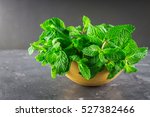 Green Mint In A Wooden Bowl On...