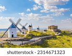 Small photo of landscape mill spain clouds and castle La Mancha Consuegra with