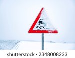 Snow covered traffic sign ...