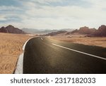 Small photo of Road in the desert, Empty road. , Travel Highway through the Sahara showing the texture of asphalt sand street, mountain, and hills landscape with dust skyline on a sunny summer day in the background
