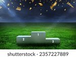 Small photo of soccer sport podium on grass inside the stadium - Podium for 1st, 2nd, and 3rd Places of 3 Winners - Awards stand stage on Grassy Field - Evening sky over green grass field with celebration papers