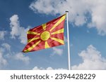 Small photo of Macedonian flag waving in the beautiful sky.