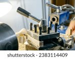 Small photo of turning a tuning peg of a vihuela on the lathe