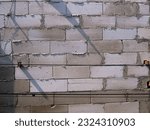 Small photo of block of concrete walls that make up a strong building, stacked crosswise
