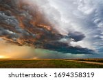 Stormy sky with dramatic clouds from an approaching thunderstorm at sunset