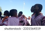 Small photo of Raja Ampat, Indonesia, Aug 17, 2018: Energetic primary school children from Raja Ampat joyfully sing the Indonesian national anthem during the 73rd Independence Day celebration at their school field.