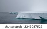 Small photo of Layers of serrated, ice shelf; Ross iced shelf, Antarctica; Ross ice shelf, below mountainside; Antarctica; Ross ice, shelf with distant mountains; Antarctica; Ross, ice shelfed, Antarctica Bay