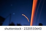 Small photo of Fire flouting in the night sky