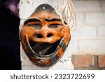 Small photo of Unsettling African mask exudes an eerie aura, sending shivers down your spine. Its haunting presence captures the essence of primal fears. Ideal for horror-themed designs, chilling editorials, or spin
