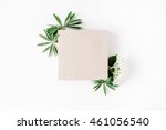 flat lay frame with craft box, white hydrangea, branches, leaves and petals isolated on white background. top view