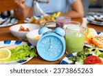 Small photo of Woman diet plan with Blue alarm clock with IF (Intermittent Fasting) 16 and 8 diet rule and weight loss concept.-Diet plan concept