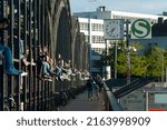 Small photo of May 23, 2021 Germany, Munich Young people sitting on the viaduct structure above the railway line, near the ZOB station.