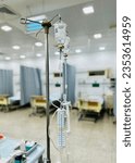 Small photo of Transfusion set with medication bottle hanging from a stand in hospital for iv drip.