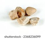 Small photo of The dibs are five small stones. The dibs are children toys from the 90s on a white background.