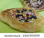 Small photo of Maryam bread with sprinkles of sprinkles photographed up close
