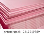 Small photo of Pink Extruded Polystyrene XPS foam thermal insulation boards stacked in the construction site. High Density, water absorption. Eco energy saving technology