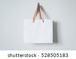 Mock-up of blank craft package, mockup of white paper shopping bag with handles on the neutral background