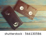 Video cassettes on the blue wooden surface . Back to the past.