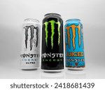 Small photo of DRESDEN, GERMANY - 29. December 2023: Monster energy most popular flavors. The Original energy drink, Ultra White and Mango Loco together. Sweet and fruity lifestyle beverages in a studio.