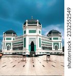 Small photo of Masjid Raya Al-Mashun or better known as Masjid Raya Medan is a mosque located in Medan City, North Sumatra Province, Indonesia. This mosque was built in 1906 and completed in 1909.