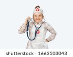 Funny kid girl playing a doctor ...