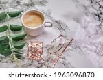 coffee cup, top view of coffee cup and eyeglasses on marble table background