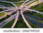 Highway Interchange loops and turnarounds , travel destination and following the busy highway system aerial drone look looking down from above curved raised roadways in Austin Texas USA