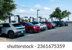 Small photo of Austin , Texas , USA - September 5th 2023: Electrify America Charging Stations full of Electric Cars and Electric Trucks charging up on Holiday