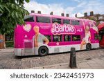 Small photo of Barbie double decker bus parked in Hampstead in London, number 24 bus, near Pond St NW3. Promoting the new Barbie movie. 4th August 2023