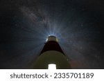 Lighthouse Astrophotography background looking from below milky way 