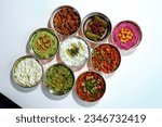 Small photo of Traditional Turkish and Greek food appetizer table. Grilled eggplant salad (saksuka), Anamur salad,Ghanoush (Mutabbal), pasha appetizer, spicy paste or harissa, purslane salad.