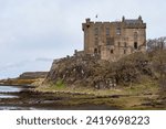 Small photo of Dunvegan, Isle of Skye, Scotland, UK - April 10, 2022: somber atmosphere over the impressive medieval castle and fortress, ancestral home of MacLeod Chiefs, one of oldest and prominent Scottish Clans