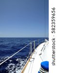 Small photo of Recreational yacht trip, view of the bow portside, on a very sunny day on the Atlantic Ocean nearby Canary Islands, Spain, summer holiday concept or leisure vacation activity in a tropical destination