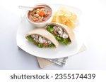 Small photo of chicken tuna salad kebab open pocket bread with tomato abc soup and crispy potato chips combo healthy set in plate on white background asian halal food cuisine vegan menu for cafe design