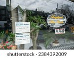 Small photo of Toronto, Ontario, Canada - April 6, 2013: exterior display window and sign of Krystyna's Hair Studio, a hair salon, located at 115 Roncesvalles Avenue