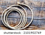 Small photo of rope gyrate on a wooden table