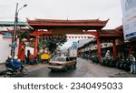 Small photo of Bogor, West Java, Indonesia on February 5, 2022: The gate enters Jalan Surya Kencana, Bogor, which is often traversed by cars and motorbikes.