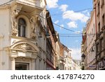 Small photo of SARAJEVO, BOSNIA AND HERZEGOVINA - SEPTEMBER 4, 2009: Two atlantes supporting a balcony above the entrance to the pharmacy on the corner of Ferhadija street and Fra Grge Martica square.