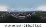 Small photo of Wide 360 panorama of medieval city seen from across the river IJssel passing the white countenance facades on the boulevard