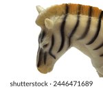 The muzzle of a toy zebra on a...