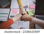 Small photo of A group of startup businessmen joining hands, business meetings, startup company sales team meetings, brainstorming and summary of company performance. Business strategy management concept.