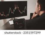 Small photo of Person looking at stock chart, businessman stock investor trading stocks, stock market analysis for profitable trading, investing in cryptocurrencies. Concept of investing in stocks.