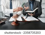 Small photo of Two lawyers are meeting together to brainstorm ideas. Lawyers seek legal information together to plan how to represent their clients in cases, applying the law fairly and honestly. Lawyer concept.