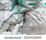 Small photo of Surabaya, Indonesia - September 4 2023: pile of sacks filled with rubbish. bag, dump, junk, garbage, environment, plastic, industrial, ecology, recycle, thrash, stack, pollution, urban waste, disposal